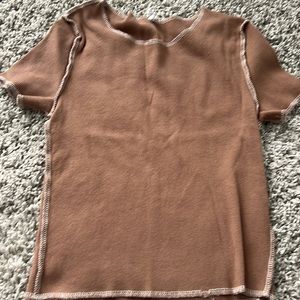 I am selling a small brown and white ribbed crop top